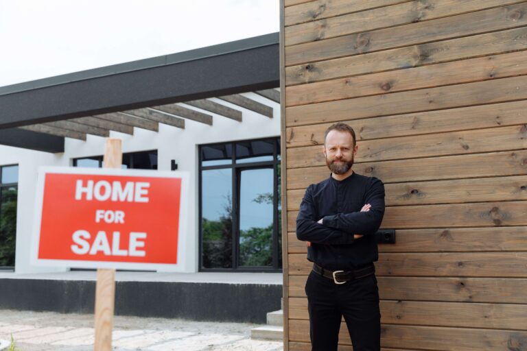 Real estate investor standing in front of an Arizona rental property purchased with a DSCR loan